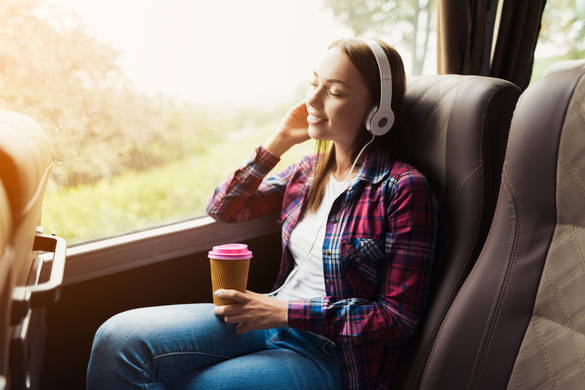 Woman listening to music on bus